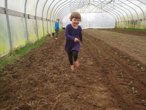 Running in the greenhouse barefoot! JOY!