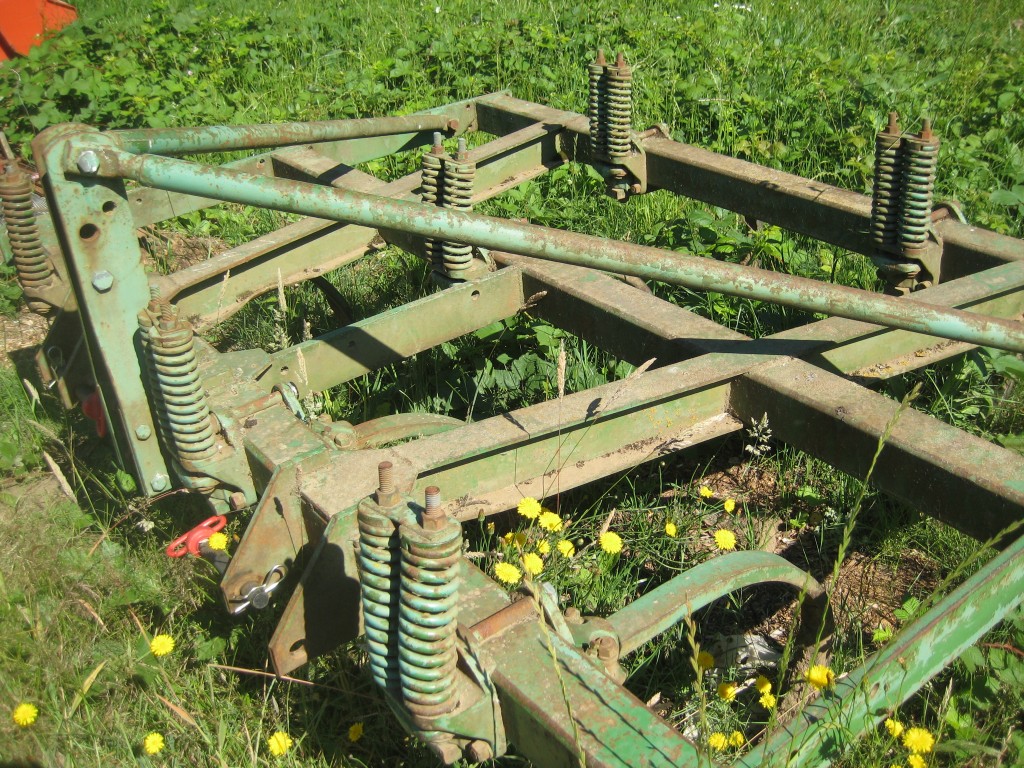 At breakfast this morning, Casey was extolling the virtues of our current tillage system (as well as pondering new improvements for future seasons). This tool, our chisel plow, has been especially helpful this year. It has only a few strong tines, which get dropped very deep into the ground to run straight through. They break up any hard "pan" deep below the surface without turning the surface. The result is a lighter soil that still has plenty of healthy soil life.